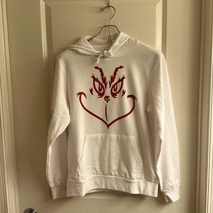 White hoodie with grinch face in red and red tiny snow ❄️ flake size: M